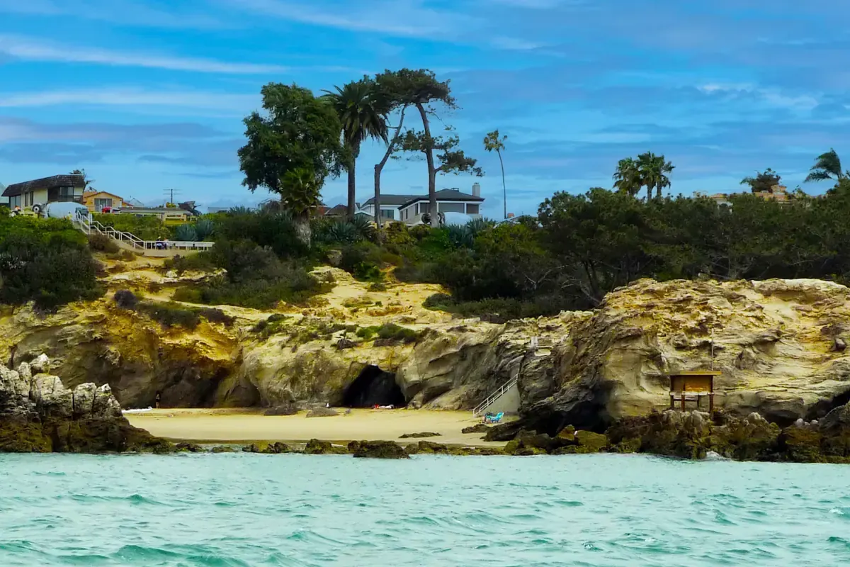 Sandstone cliffs and bluff-top houses above a cove at Corona del Mar, Newport Beach CA