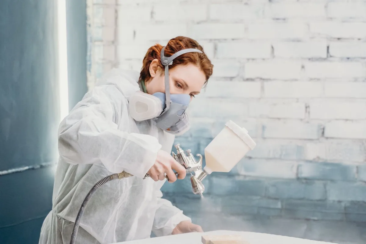 Cabinet doors being prepared and sprayed, the work the federal lead rule governs in pre-1978 housing