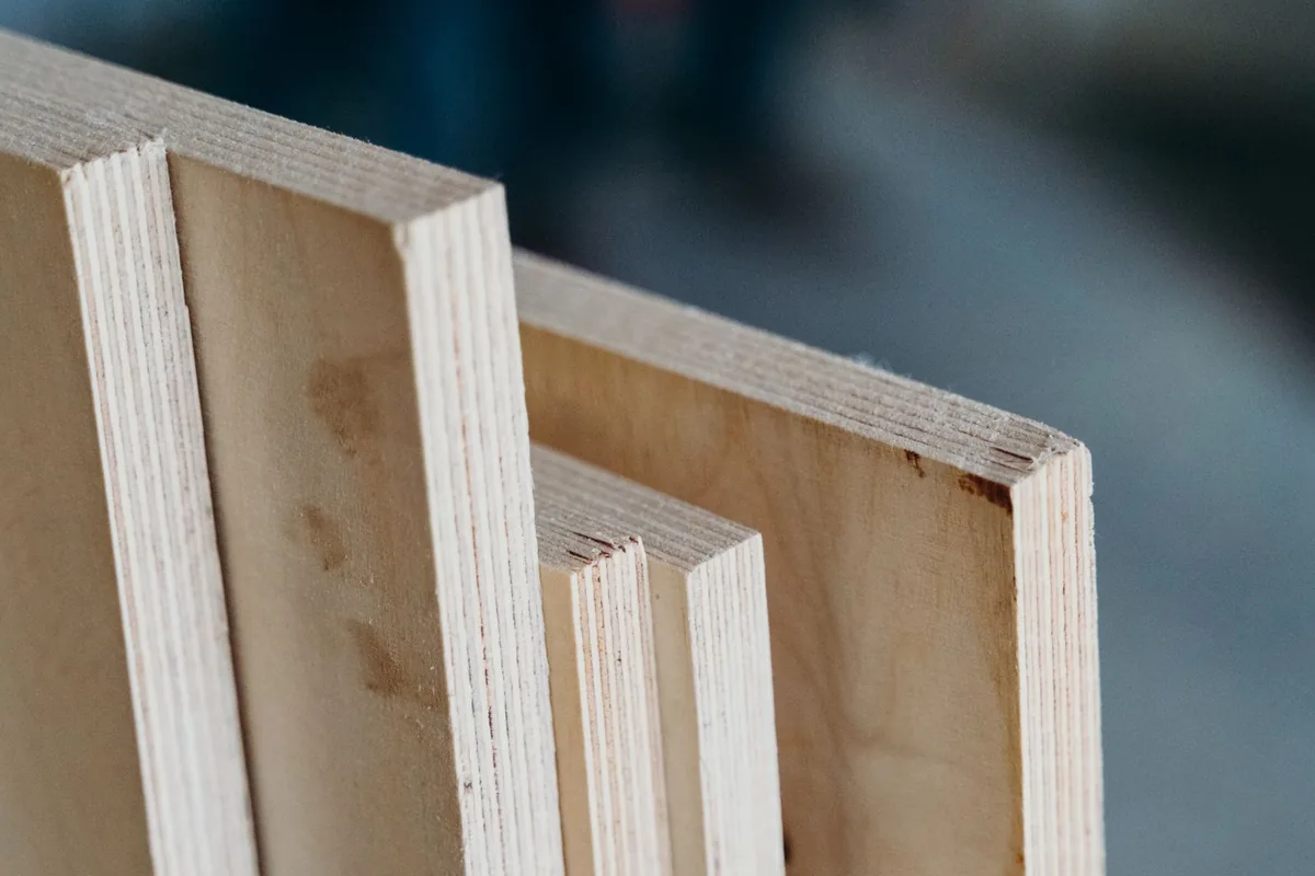 Plywood panel edges showing the layered plies, the preferred carcass material for a Newport Beach CA kitchen sink base